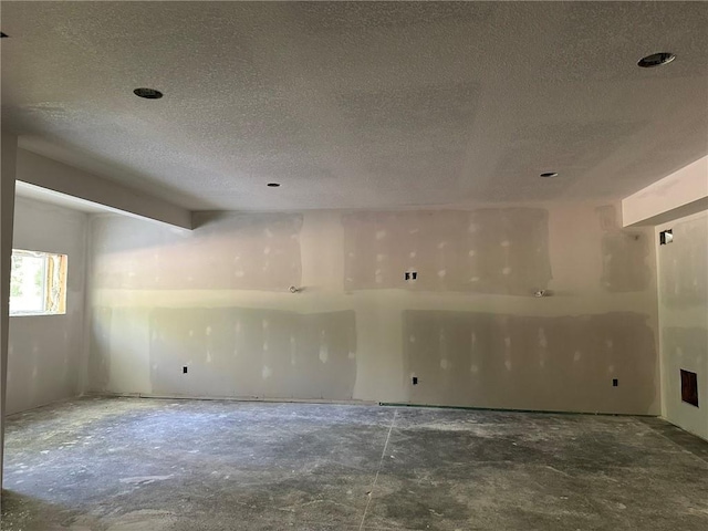 17162 S Hall St, Olathe, KS 66062 - unfurnished room featuring a textured ceiling and concrete flooring