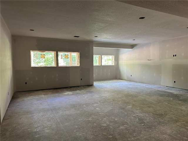 17162 S Hall St, Olathe, KS 66062 - spare room with unfinished concrete floors and a textured ceiling
