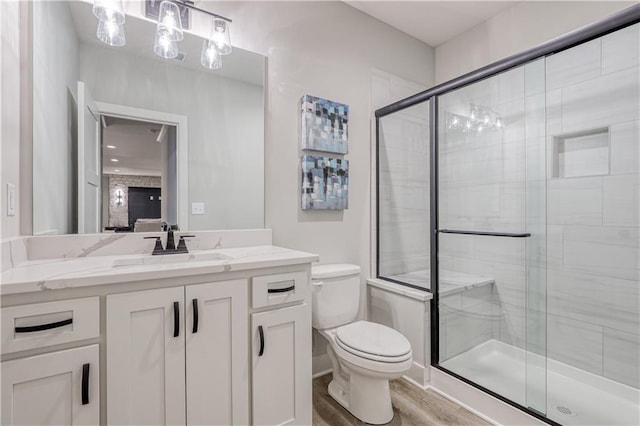 17162 S Hall St, Olathe, KS 66062 - bathroom with vanity, a shower stall, and wood finished floors
