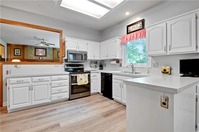 8215 W 150th St, Overland Park, KS 66223 - kitchen with stainless steel appliances, a sink, a peninsula, white cabinets, and light wood-style floors