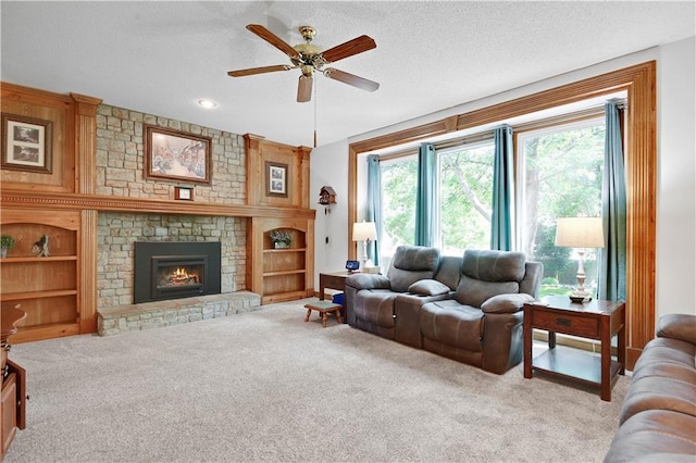 8215 W 150th St, Overland Park, KS 66223 - carpeted living area featuring ceiling fan, a brick fireplace, and a textured ceiling