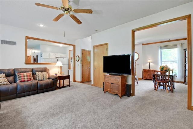8215 W 150th St, Overland Park, KS 66223 - living room with light colored carpet, a ceiling fan, baseboards, and recessed lighting
