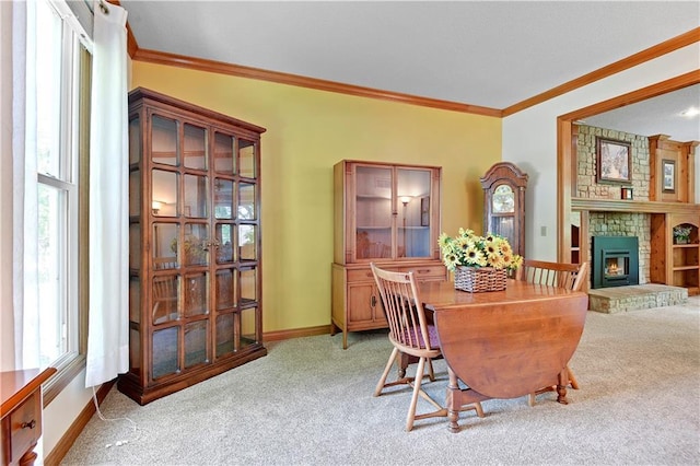 8215 W 150th St, Overland Park, KS 66223 - dining space featuring carpet flooring, ornamental molding, plenty of natural light, baseboards, and a fireplace