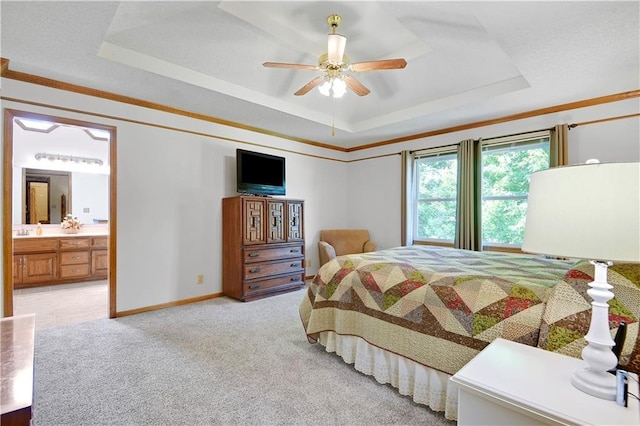 8215 W 150th St, Overland Park, KS 66223 - bedroom with a raised ceiling, light carpet, connected bathroom, ceiling fan, and baseboards