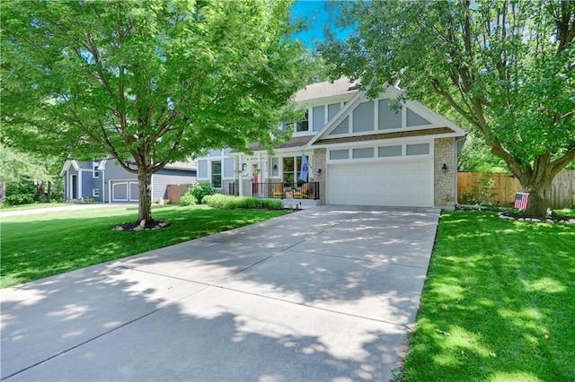8215 W 150th St, Overland Park, KS 66223 - view of front facade with concrete driveway, brick siding, and a garage