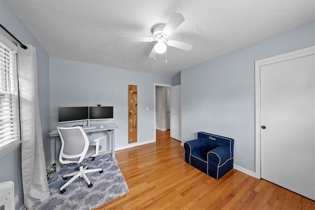 607 E 110th St, Kansas City, MO 64131 - office with wood finished floors, ceiling fan, a textured ceiling, and baseboards