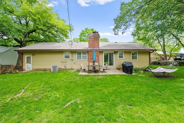 607 E 110th St, Kansas City, MO 64131 - back of house featuring a chimney, a patio, and cooling unit