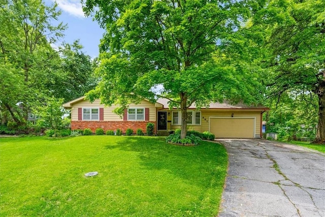 607 E 110th St, Kansas City, MO 64131 - ranch-style home featuring driveway, a garage, brick siding, and a front yard