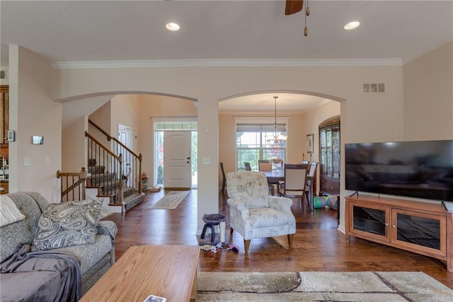 25005 W 85th Ter, Lenexa, KS 66227 - living room featuring arched walkways, stairs, wood finished floors, ornamental molding, and recessed lighting