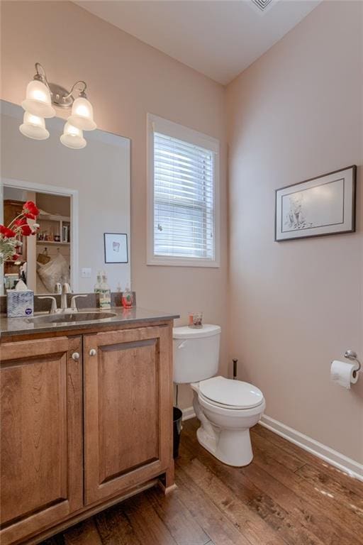 25005 W 85th Ter, Lenexa, KS 66227 - half bath featuring vanity, wood finished floors, and a chandelier