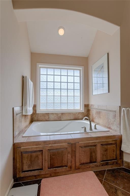 25005 W 85th Ter, Lenexa, KS 66227 - bathroom with a garden tub, tile patterned flooring, and vaulted ceiling