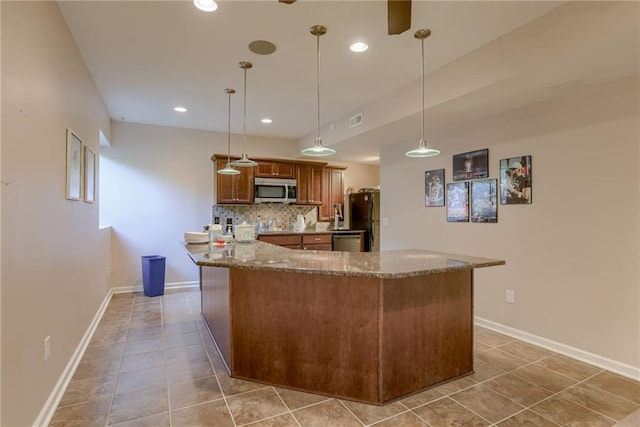 25005 W 85th Ter, Lenexa, KS 66227 - kitchen with stainless steel appliances, brown cabinets, stone countertops, tasteful backsplash, and light tile patterned flooring