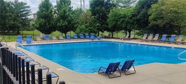 25005 W 85th Ter, Lenexa, KS 66227 - community pool with a patio area and view of wooded area