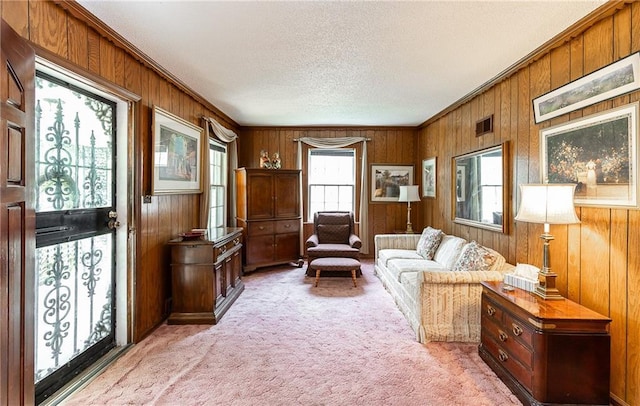 6038 Catalina St, Fairway, KS 66205 - living area featuring wooden walls, light carpet, a textured ceiling, and crown molding