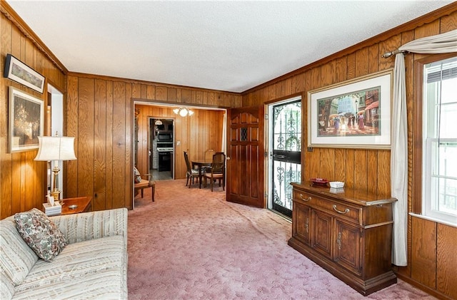 6038 Catalina St, Fairway, KS 66205 - living room with wooden walls, crown molding, carpet flooring, and a textured ceiling
