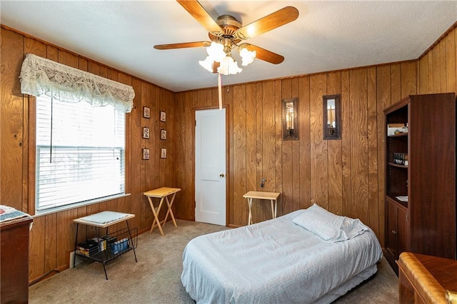 6038 Catalina St, Fairway, KS 66205 - carpeted bedroom with wooden walls and ceiling fan