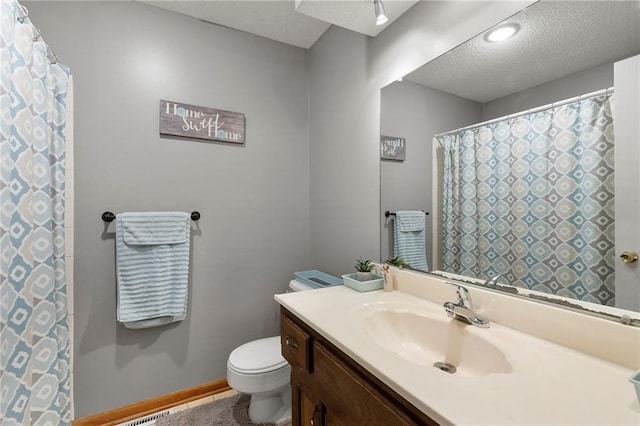 215 SE Country Ln, Lees Summit, MO 64063 - bathroom featuring toilet, vanity, a textured ceiling, and baseboards