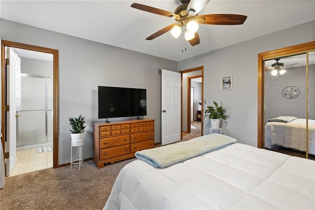 215 SE Country Ln, Lees Summit, MO 64063 - carpeted bedroom featuring a closet, a ceiling fan, ensuite bathroom, and baseboards
