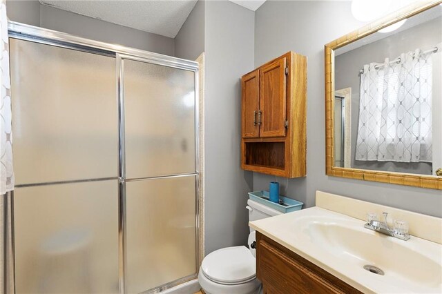 215 SE Country Ln, Lees Summit, MO 64063 - bathroom with toilet, a shower stall, and vanity