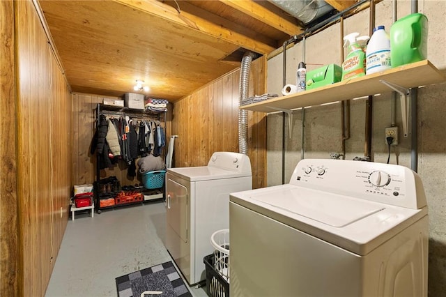 215 SE Country Ln, Lees Summit, MO 64063 - laundry room with washer and clothes dryer, wooden ceiling, and wooden walls