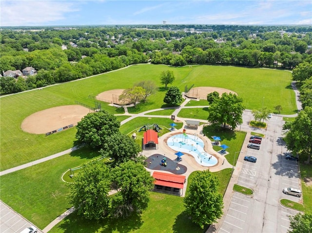 215 SE Country Ln, Lees Summit, MO 64063 - bird's eye view of a pool and a tree filled landscape