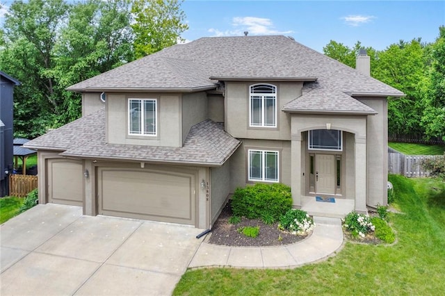 13808 Richards St, Overland Park, KS 66221 - french country home featuring stucco siding, roof with shingles, driveway, and a chimney