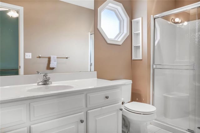 13808 Richards St, Overland Park, KS 66221 - full bathroom with toilet, a stall shower, vanity, and tile patterned flooring