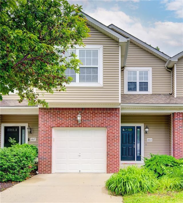 8815 Timber Creek Ln, Pleasant Valley, MO 64068 - view of property featuring a garage, driveway, and brick siding