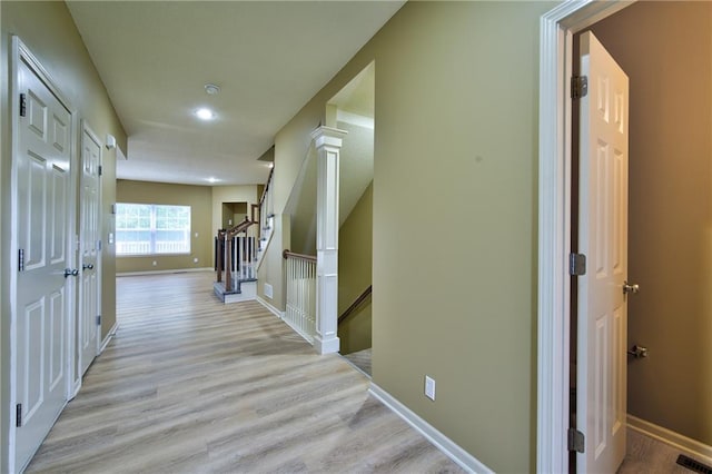 8815 Timber Creek Ln, Pleasant Valley, MO 64068 - hallway with light wood finished floors, baseboards, recessed lighting, an upstairs landing, and stairs