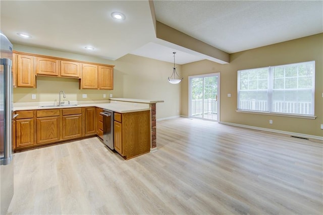 8815 Timber Creek Ln, Pleasant Valley, MO 64068 - kitchen with a sink, dishwasher, light wood-type flooring, a peninsula, and baseboards