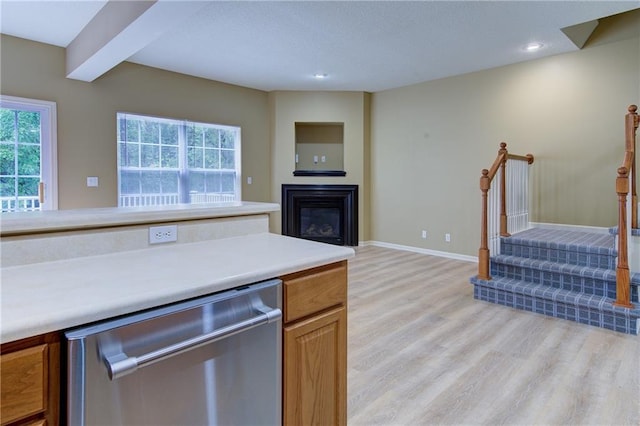 8815 Timber Creek Ln, Pleasant Valley, MO 64068 - kitchen with dishwasher, light wood finished floors, plenty of natural light, light countertops, and recessed lighting