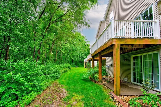 8815 Timber Creek Ln, Pleasant Valley, MO 64068 - view of green lawn featuring a deck