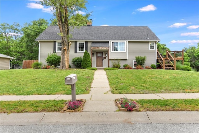 530 Nipper Ln, Leavenworth, KS 66048 - view of front of home featuring stairs, a deck, a front yard, and a chimney