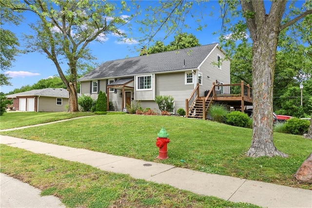 530 Nipper Ln, Leavenworth, KS 66048 - bi-level home featuring a wooden deck, stairway, a detached garage, and a front yard
