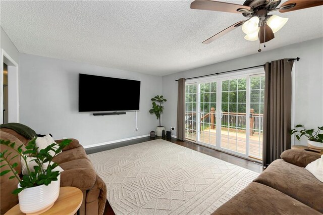 530 Nipper Ln, Leavenworth, KS 66048 - living area with a textured ceiling, a ceiling fan, baseboards, and wood finished floors