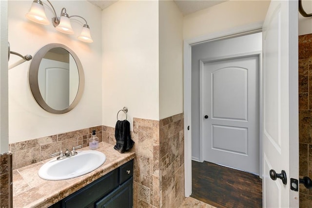 530 Nipper Ln, Leavenworth, KS 66048 - bathroom with vanity, wood finished floors, and tile walls