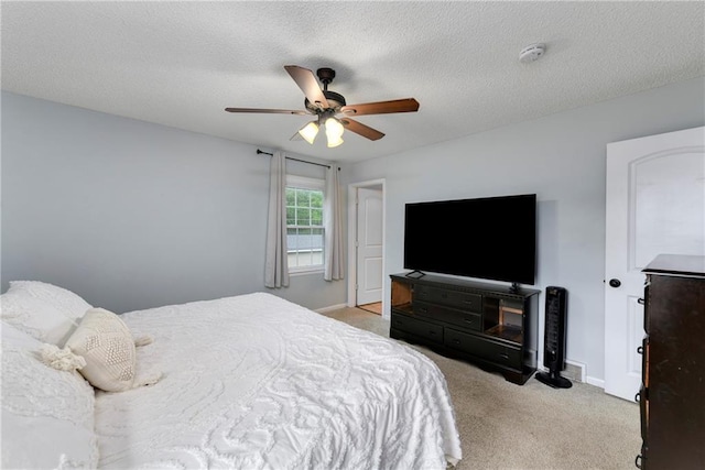 530 Nipper Ln, Leavenworth, KS 66048 - bedroom featuring light colored carpet, baseboards, a ceiling fan, and a textured ceiling