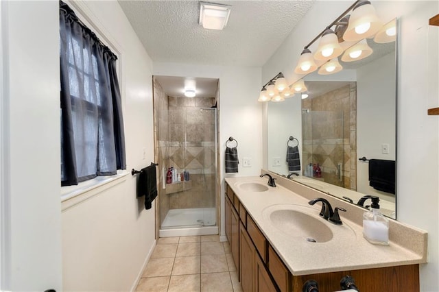 530 Nipper Ln, Leavenworth, KS 66048 - bathroom with double vanity, a shower stall, a textured ceiling, and tile patterned floors