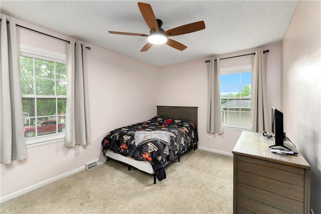 530 Nipper Ln, Leavenworth, KS 66048 - bedroom featuring carpet, a textured ceiling, baseboards, and ceiling fan