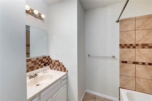 530 Nipper Ln, Leavenworth, KS 66048 - full bathroom with vanity, tile patterned flooring, a textured ceiling, tasteful backsplash, and bathing tub / shower combination