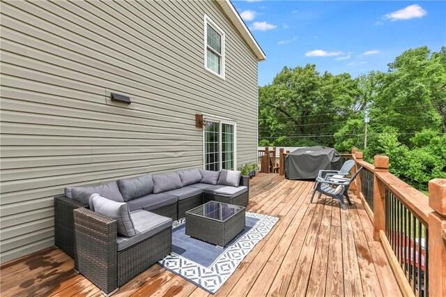 530 Nipper Ln, Leavenworth, KS 66048 - wooden deck with grilling area and an outdoor hangout area