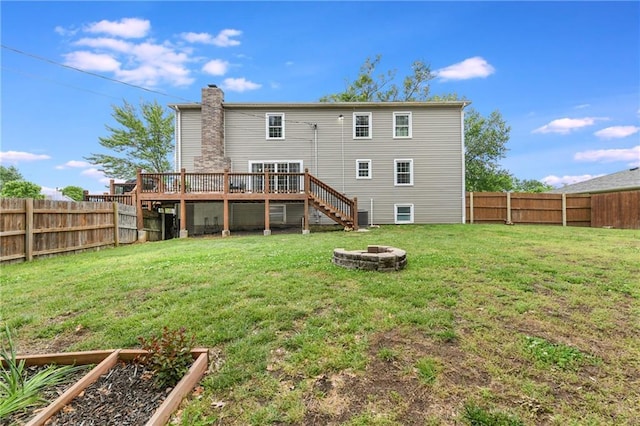 530 Nipper Ln, Leavenworth, KS 66048 - rear view of property featuring a fire pit, stairway, a wooden deck, a chimney, and central AC