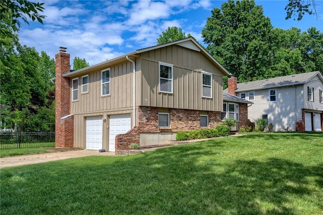 12800 W 100th St, Lenexa, KS 66215 - view of front facade with a chimney, board and batten siding, an attached garage, driveway, and brick siding