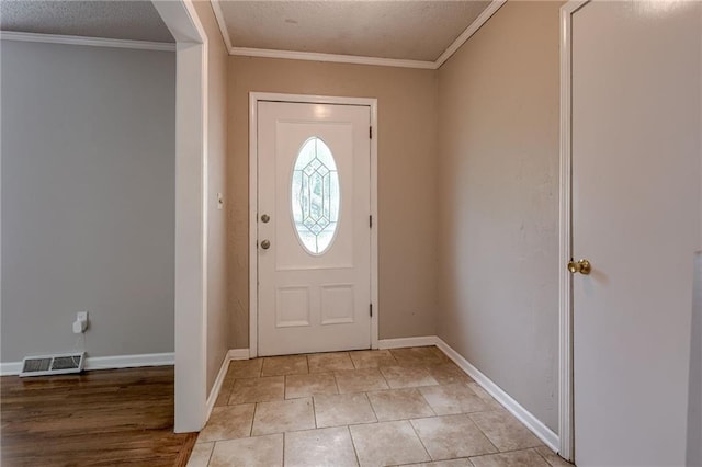 12800 W 100th St, Lenexa, KS 66215 - foyer with ornamental molding, baseboards, and light tile patterned flooring