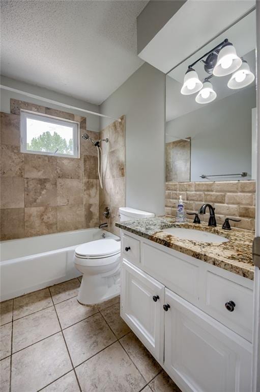 12800 W 100th St, Lenexa, KS 66215 - bathroom featuring vanity, washtub / shower combination, toilet, tile patterned flooring, and a textured ceiling