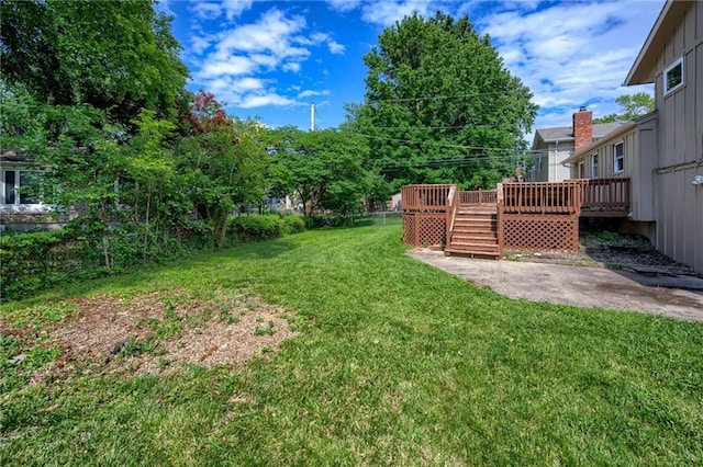 12800 W 100th St, Lenexa, KS 66215 - view of yard featuring a wooden deck, a patio, and stairs