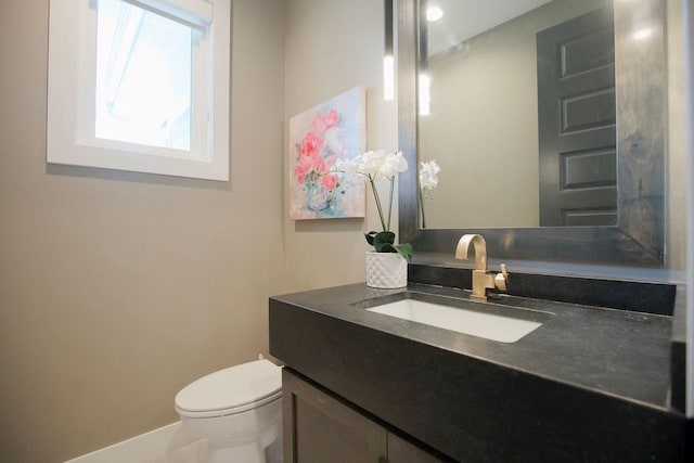 10300 W 174th St, Overland Park, KS 66221 - bathroom with vanity, toilet, and baseboards