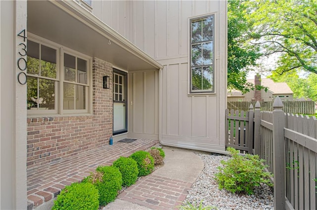4300 W 112th St, Leawood, KS 66211 - property entrance with brick siding and board and batten siding