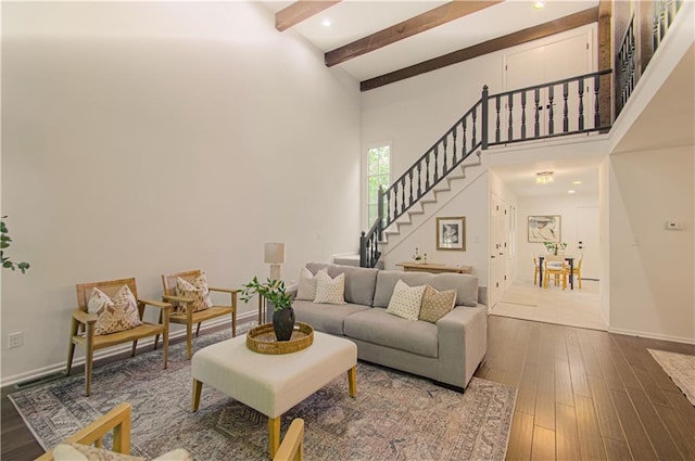 4300 W 112th St, Leawood, KS 66211 - living area featuring stairs, dark wood-type flooring, baseboards, beam ceiling, and recessed lighting