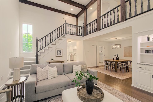 4300 W 112th St, Leawood, KS 66211 - living room featuring wood finished floors, stairway, baseboards, recessed lighting, and a high ceiling